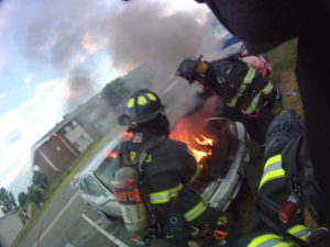 Firefighters Cokewell and Valentiner giving me a clear shot at the seat of the fire. 