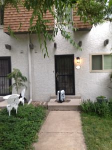 The innocuous-looking town house in question. Yes, that's my stormtrooper suitcase :-)